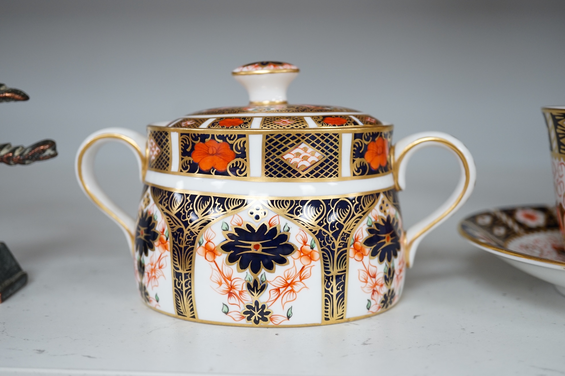 Two Royal Crown Derby sugar bowls, and a cup and saucer, largest 9cm high. Condition - good.